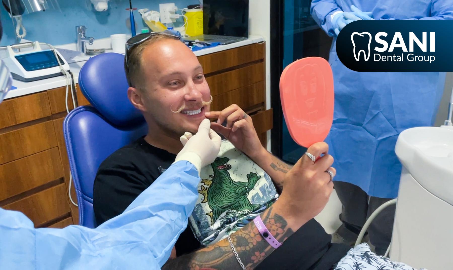 sani_dental_group_patient_smile_mirror